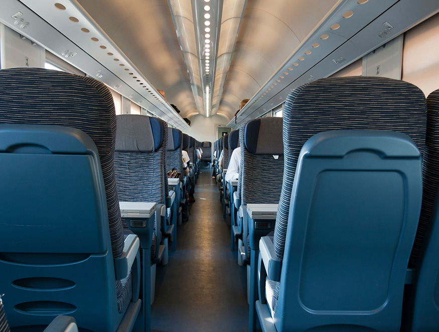 aisle of railcar showing plastic formed chair parts