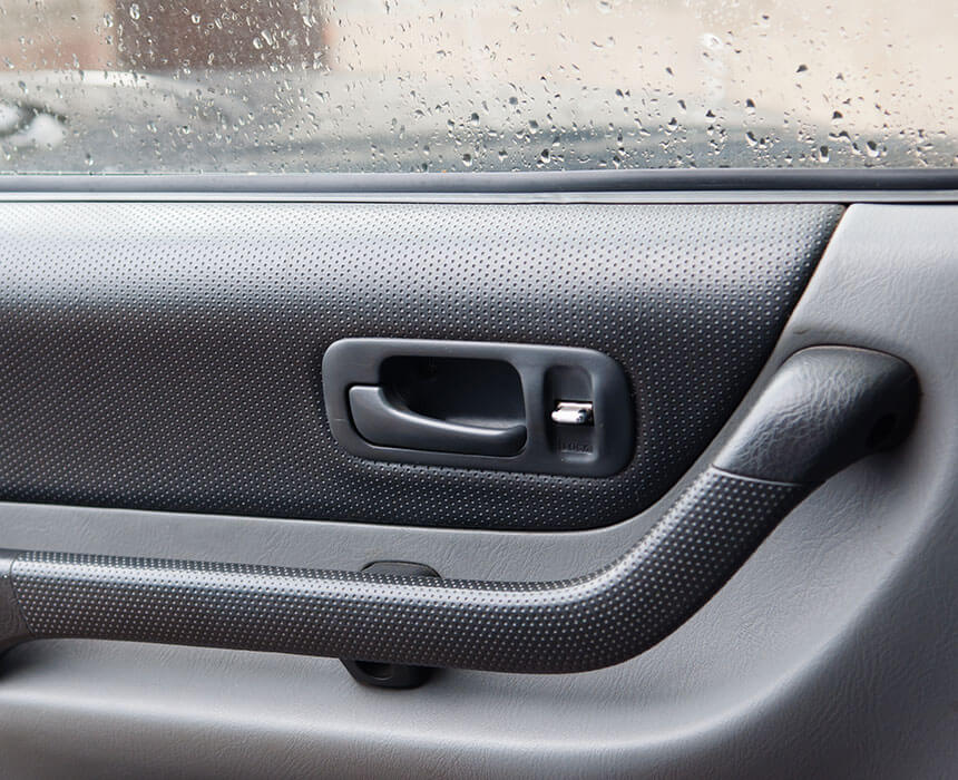 car door inside showing plastic manufactured parts