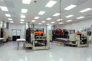 A cleanroom forming bay for custom medical device packaging.